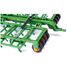 A green metal agricultural equipment part with rollers, set against a white background, showcasing its smooth surface and des