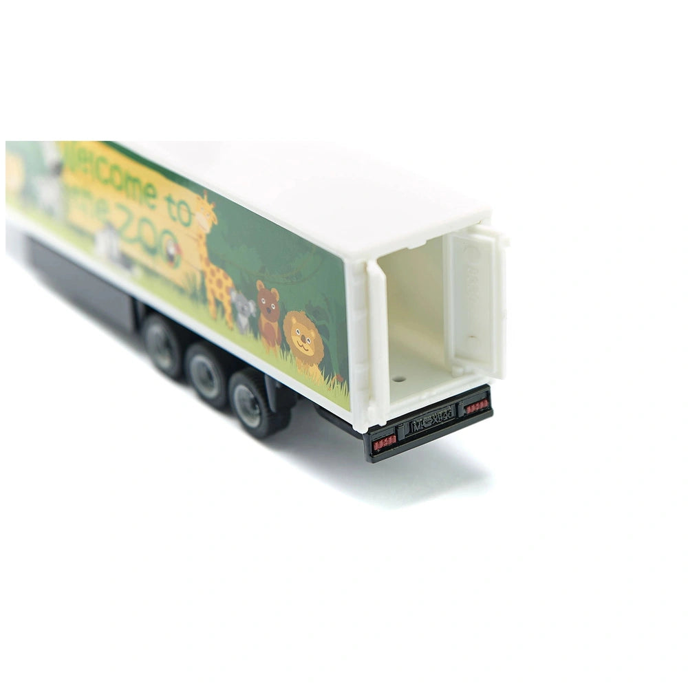 Articulated truck toy features a white body with a green and yellow design, showcasing cartoon animals and "Welcome to the Zo