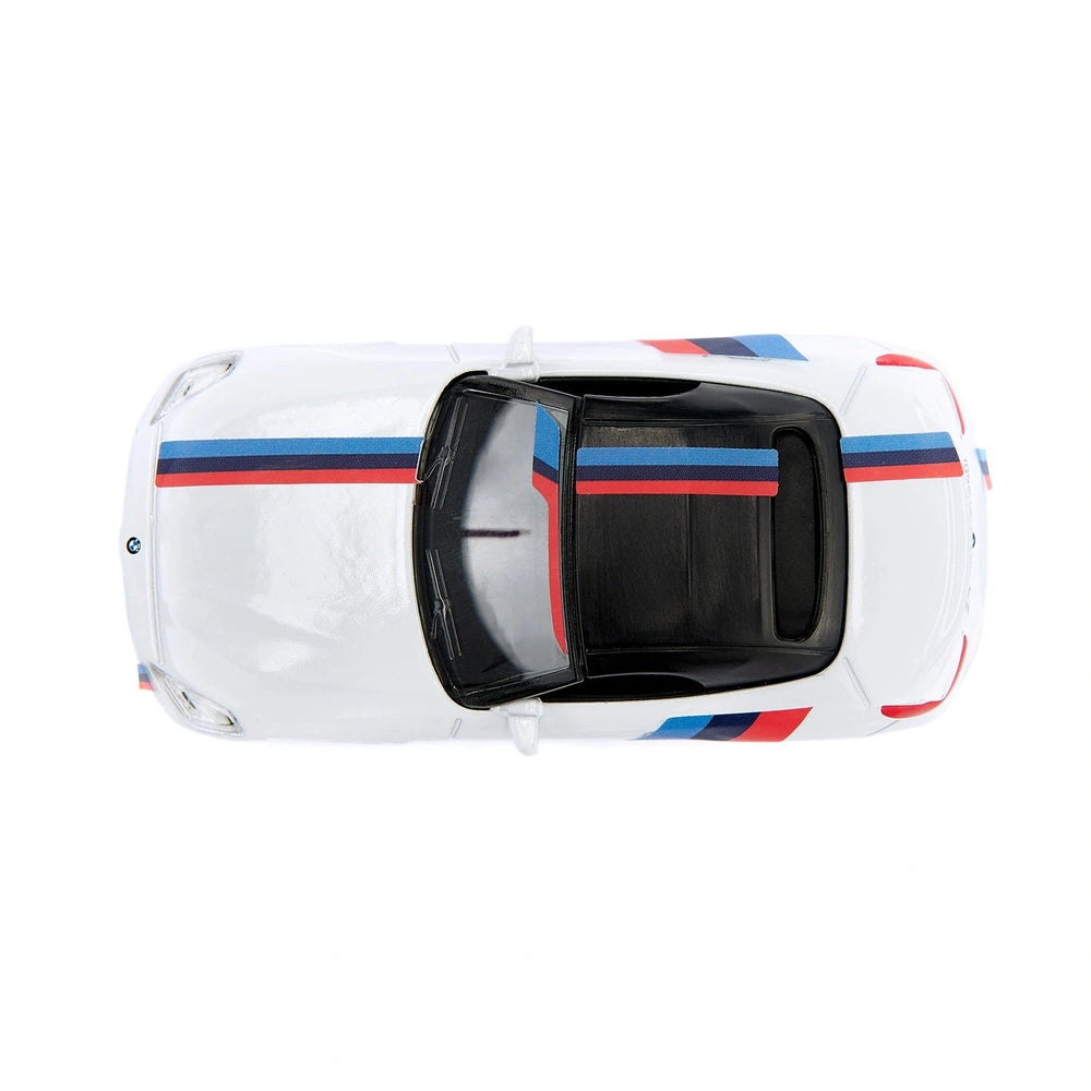 Siku BMW Z4 M40i in white with blue and red stripes, featuring an open trunk and glossy finish.