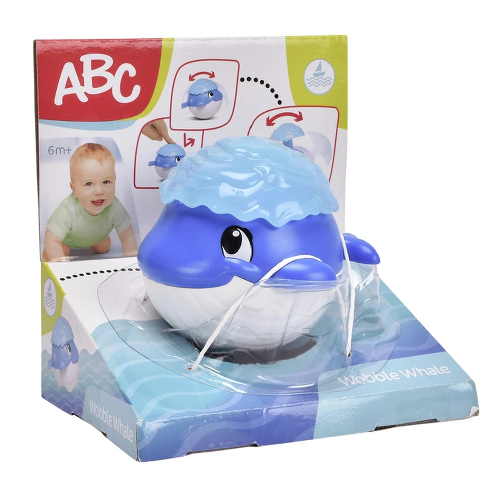 Simba ABC Wobble Whale bath toy in blue with white accents, smiling face, packaged for young children.
