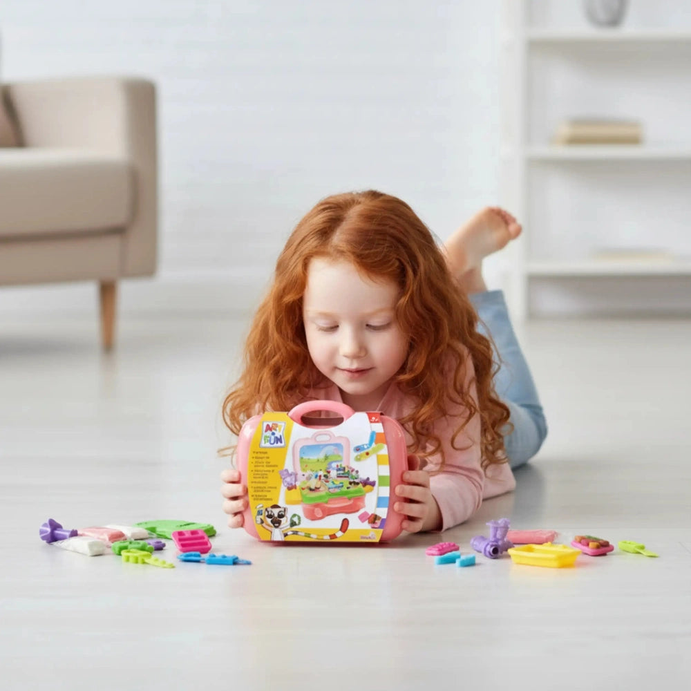 Simba Unicorn Clay Set showcased by a girl with red hair, surrounded by colorful toys in a bright playroom setting.
