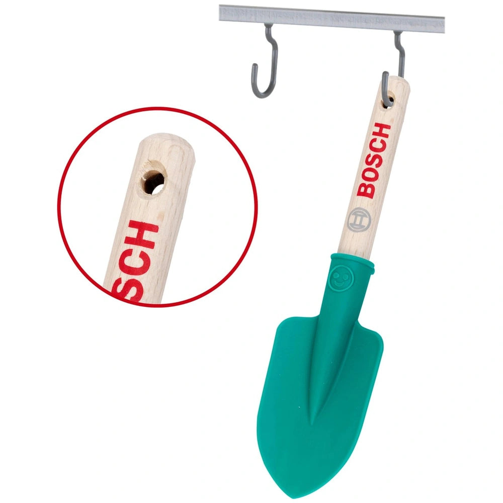 Theo Klein Bosch hand shovel features a wooden handle, green plastic blade, and metal hook with "BOSCH" label.