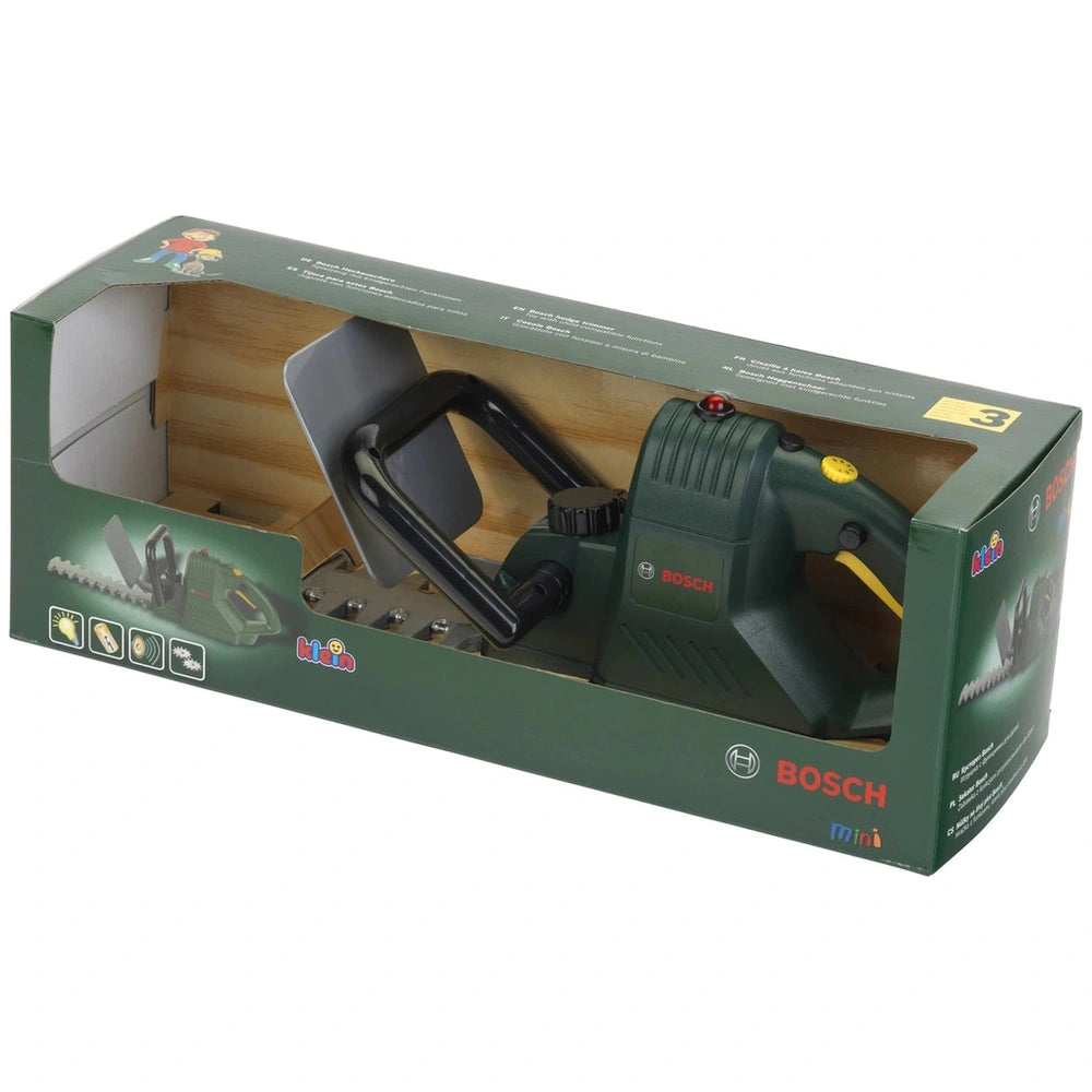 Theo Klein Bosch hedge trimmer in green with handle, trigger, battery pack, and blade, displayed in matte cardboard packaging