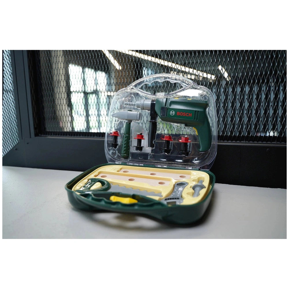 Green plastic tool case with yellow interior, featuring white screws and a screwdriver, labeled "BOSS" and "12V".