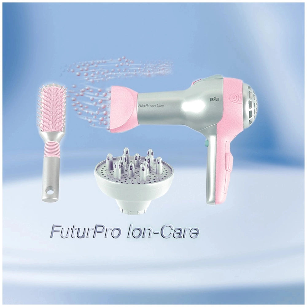 Theo Klein Braun hairdryer with silver body, pink nozzle, white diffuser, and pink bristle hairbrush for pretend play.