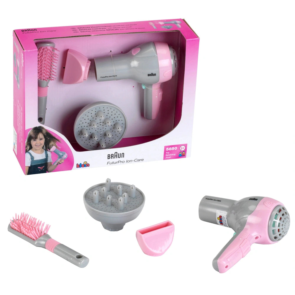 Theo Klein Braun hairdryer in pink and grey with diffuser and brush featuring pink bristles and grey handle, packaged in pink
