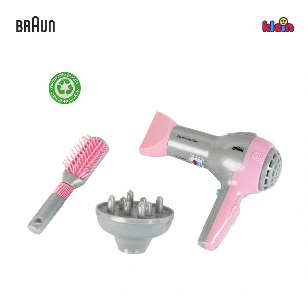 Braun hairdryer with grey body, pink handle, grey diffuser, and matching brush with pink handle and grey bristle head.