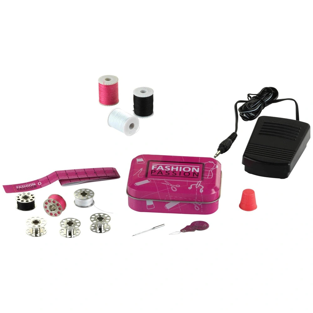 Theo Klein kids sewing machine featuring pink fabric, black wire, and clear plastic, centered in a product display.