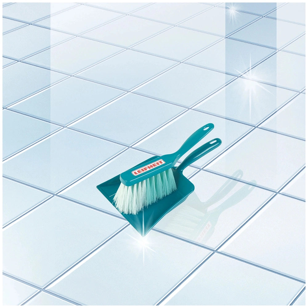 Blue and white Leifheit sweeping set brush with a labeled handle on reflective tiled floor.