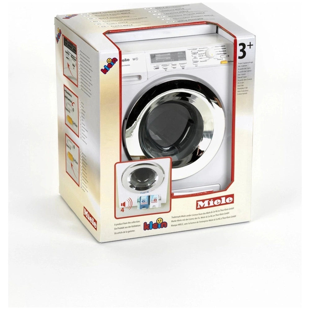 Theo Klein Miele washing machine toy in retail packaging with plastic windows and handle, designed for pretend play.